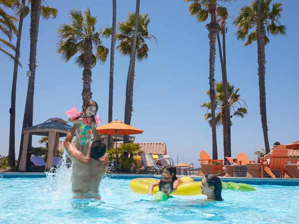 A family playing in the pool.