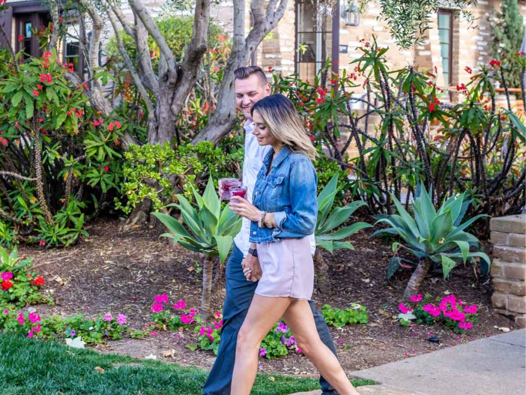 Couple Walking With Drinks.