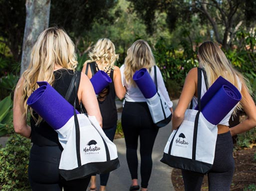 Ladies With Bags And Yoga Mats.