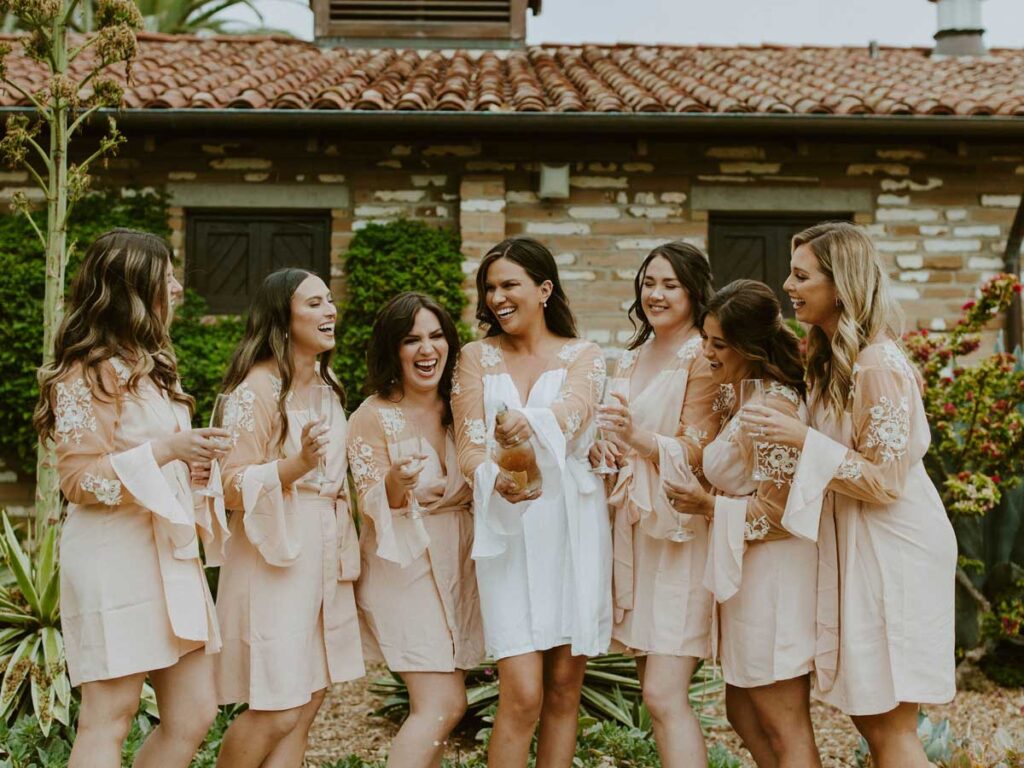 bride and friends with champagne