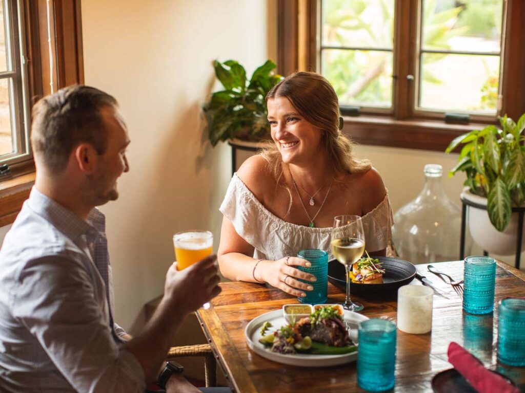 couple eating and drinking wine