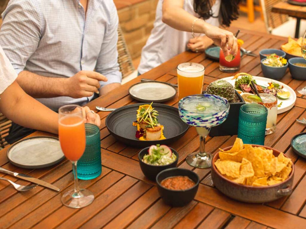 couple eating and drinking wine