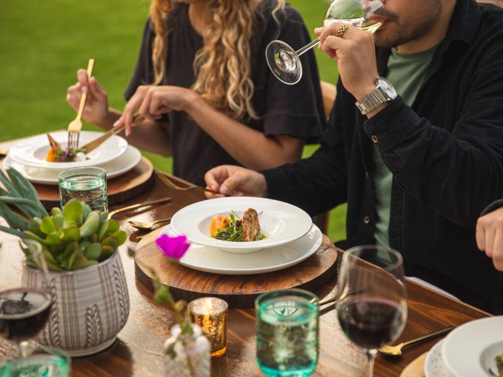 couple eating and drinking wine