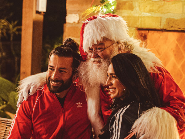 Couple Posing With Santa
